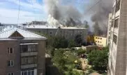 Кафе и пятиэтажный жилой дом горят в центре Петропавловска