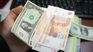 Названы официальные курсы доллара и рубля на 21 сентября