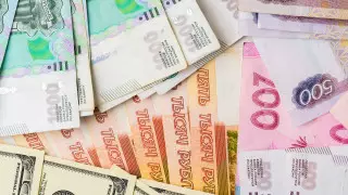 Названы официальные курсы доллара и рубля на 23 декабря