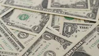 Курс доллара снизился почти на 3 тенге