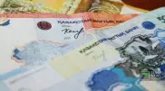 Подпись главы Нацбанка вернут на тенге