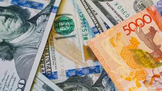 Названы официальные курсы доллара, рубля и евро на 27 сентября