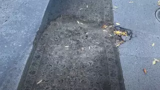 Яму на дороге прикрыли ковром в Алматы